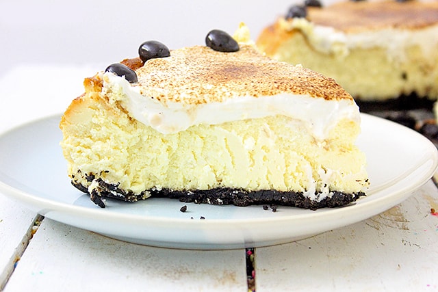 close up of espresso cheesecake on white/blue dessert plate