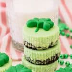 stack of mini mint cheesecakes with a glass of milk