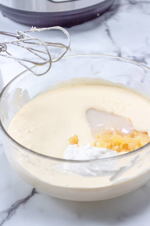 bowl of pineapple coconut cheesecake ingredients