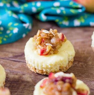 mini cheesecake on a wooden background with a blue linen