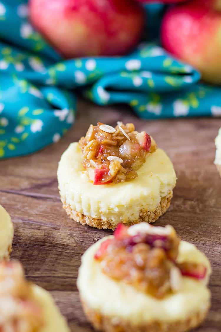 mini cheesecake on a wooden background with a blue linen