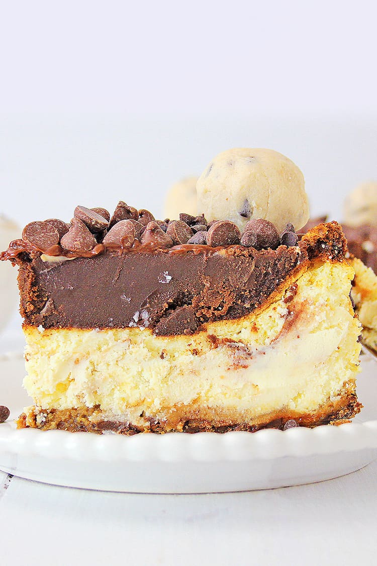 a close up image of a slice of cheesecake on a white plate