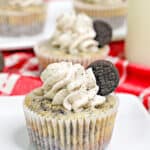 Mini oreo cheesecakes on a white plate with a red linen under the plate