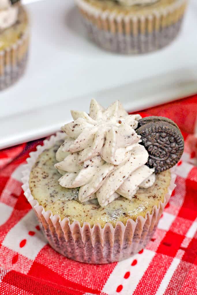 mini oreo cheesecake on a red and white linen